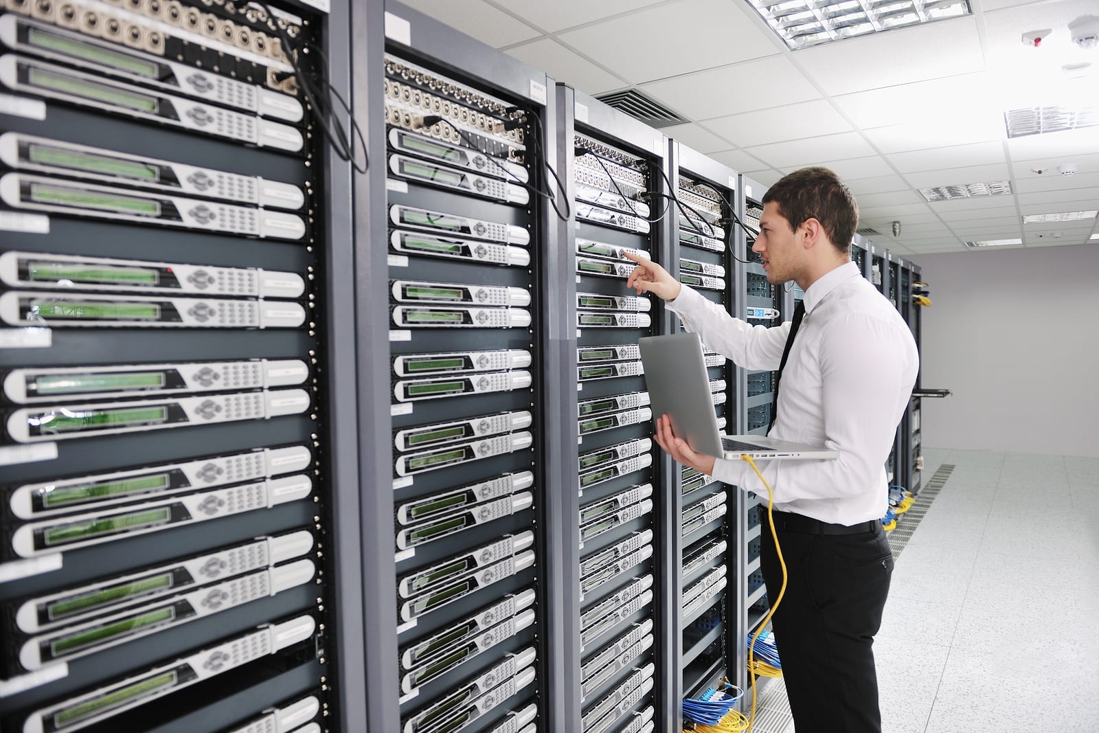 A man in a data center with grounding and lightning protection.